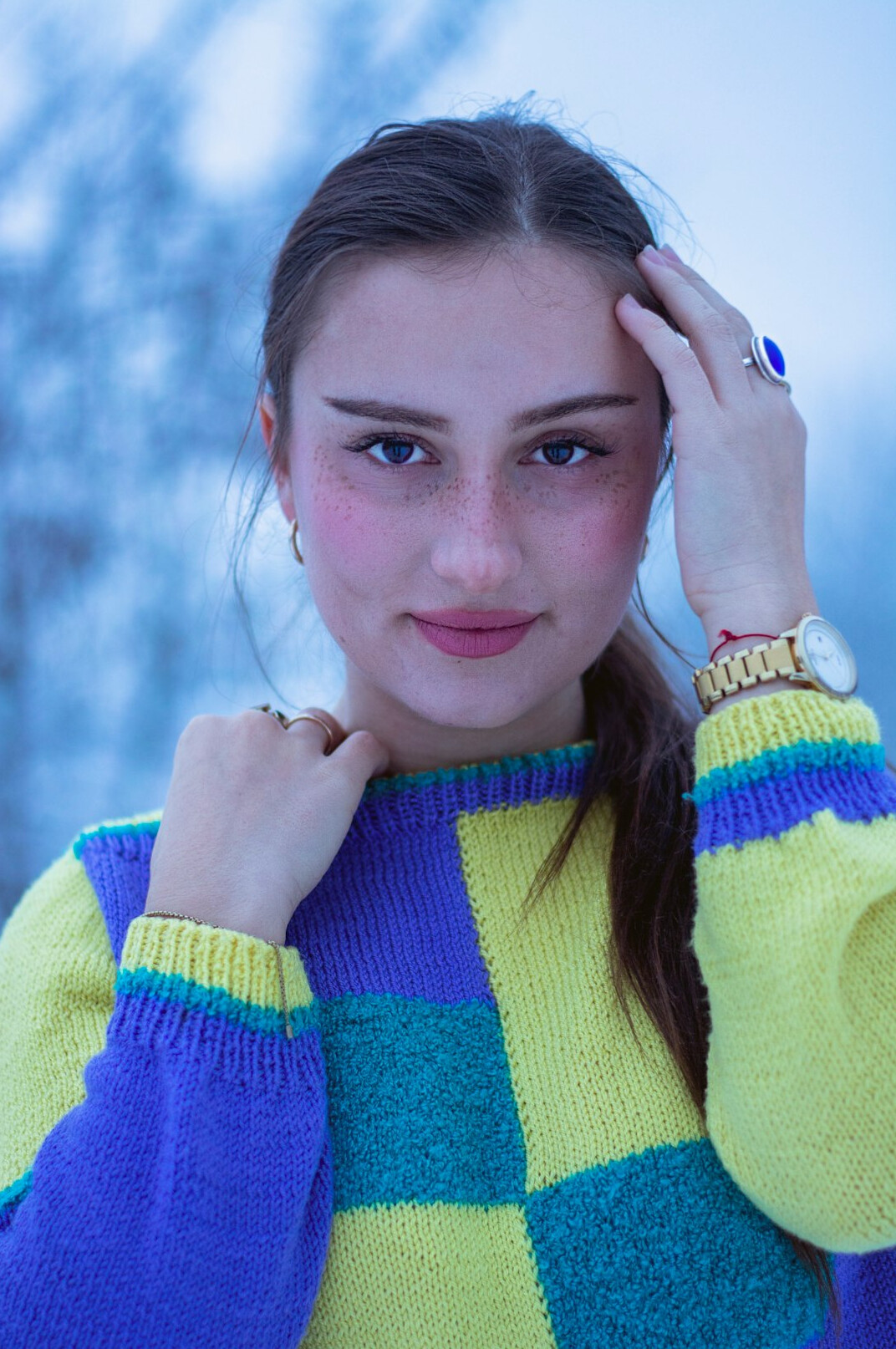 Portrait of a cheerful young woman in a bright sweater