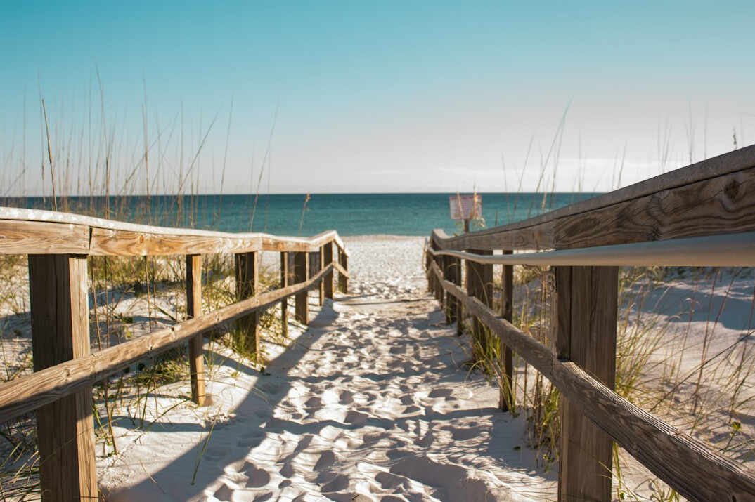 Seaside holiday beach with wooden walkway